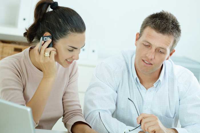 Couple talking on mobile phone