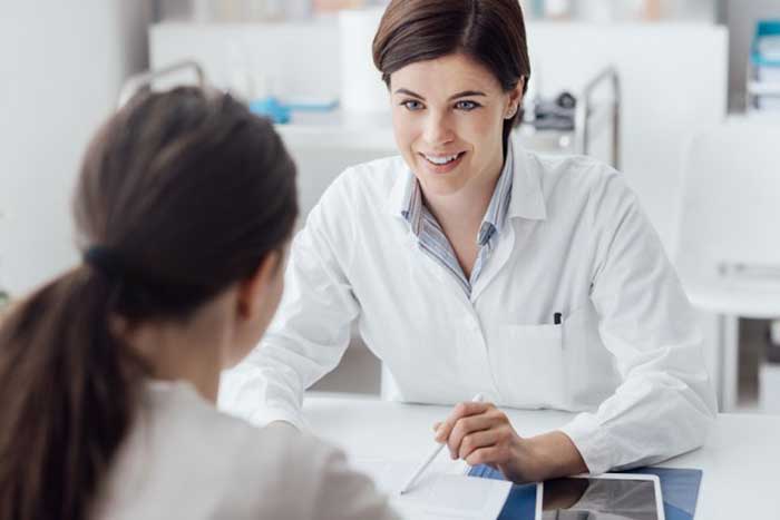 Female Doctor taking with patient