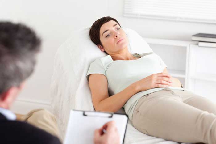 Women in hospital bedsheet