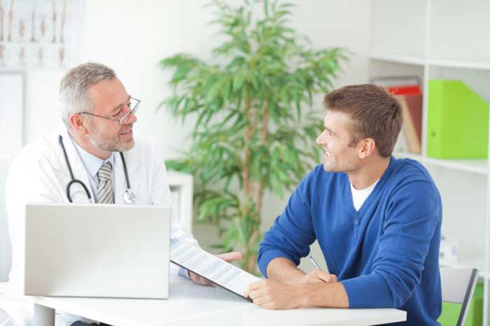 Doctor talking with patient