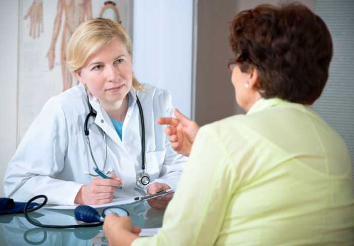 Female Doctor taking with patient