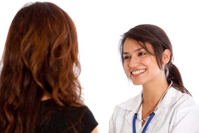 Female Doctor taking with patient