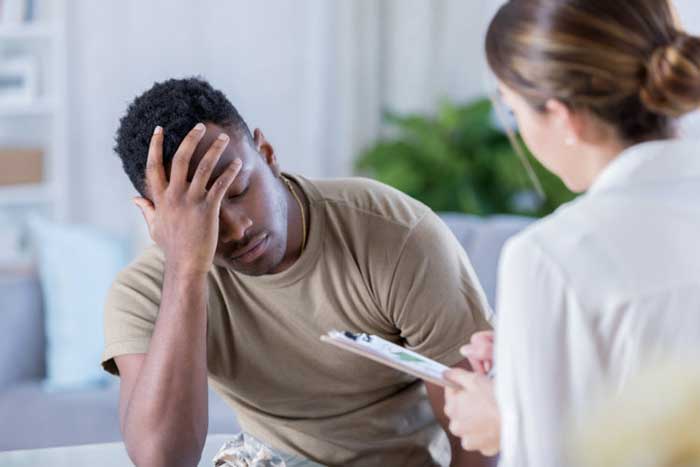 Women doctor with male patient