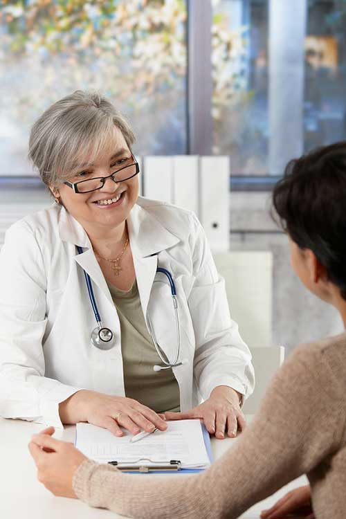 Female Doctor taking with patient