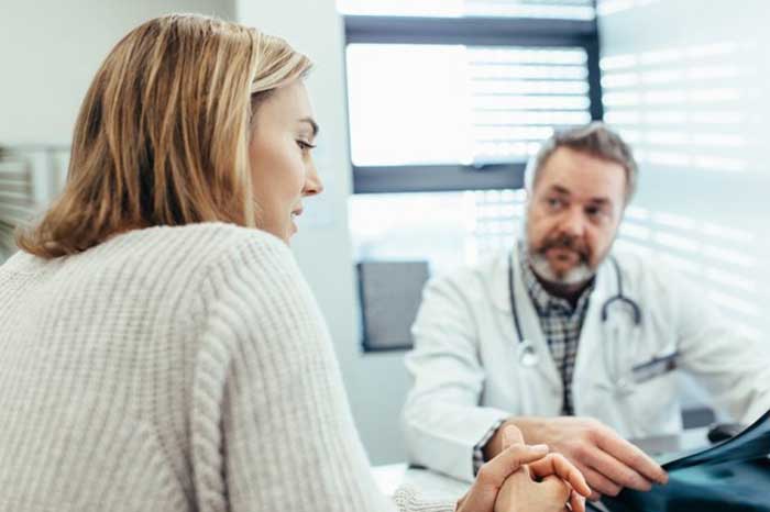 Doctor talking with patient