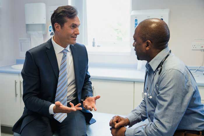 Doctor talking with patient