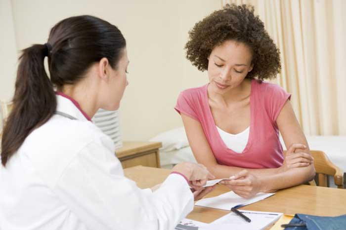 Female Doctor taking with patient