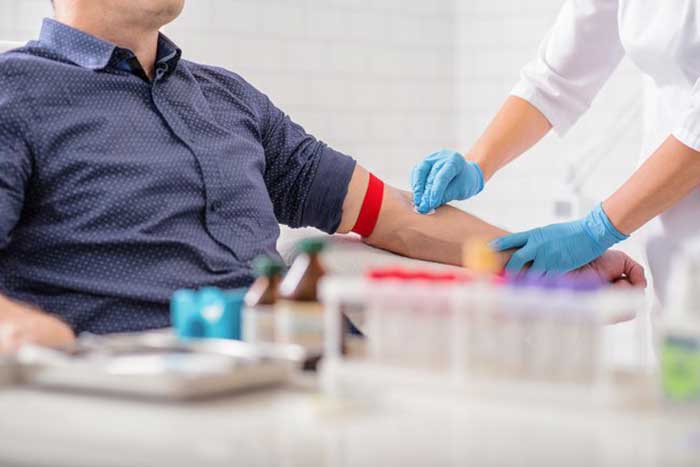 Female Doctor preparing injection for patient