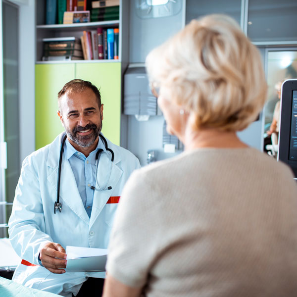 woman talking to male doctor