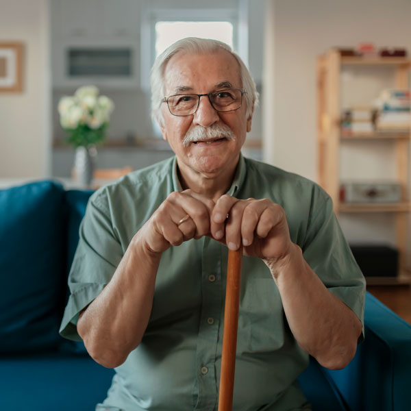 elderly man in green shirt with buttons