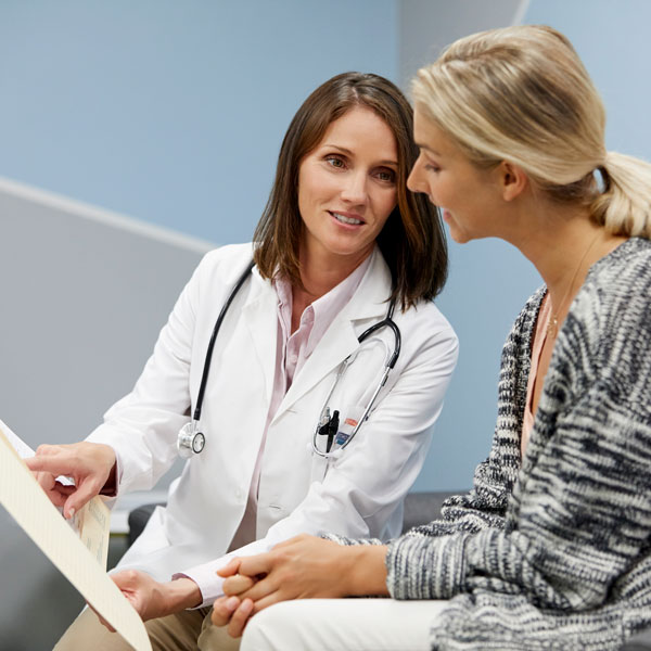 female doctor talking to patient